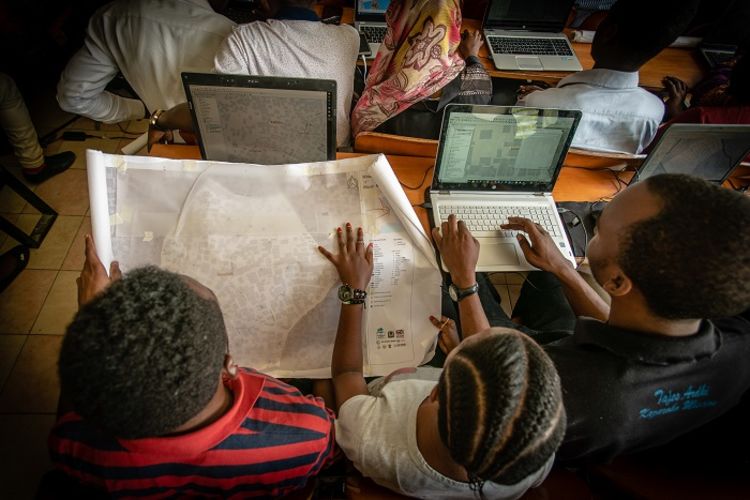 Young Tanzanians plan their next steps for a local community risk mapping exercise.
