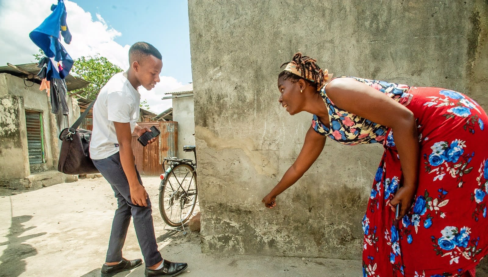 Young Tanzanians discuss how extensive recent flood events were in their neighborhood.