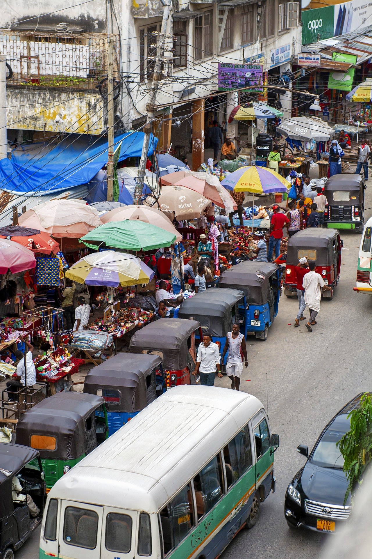 Cars parked on side of the road during daytime in Dar es Salaam.